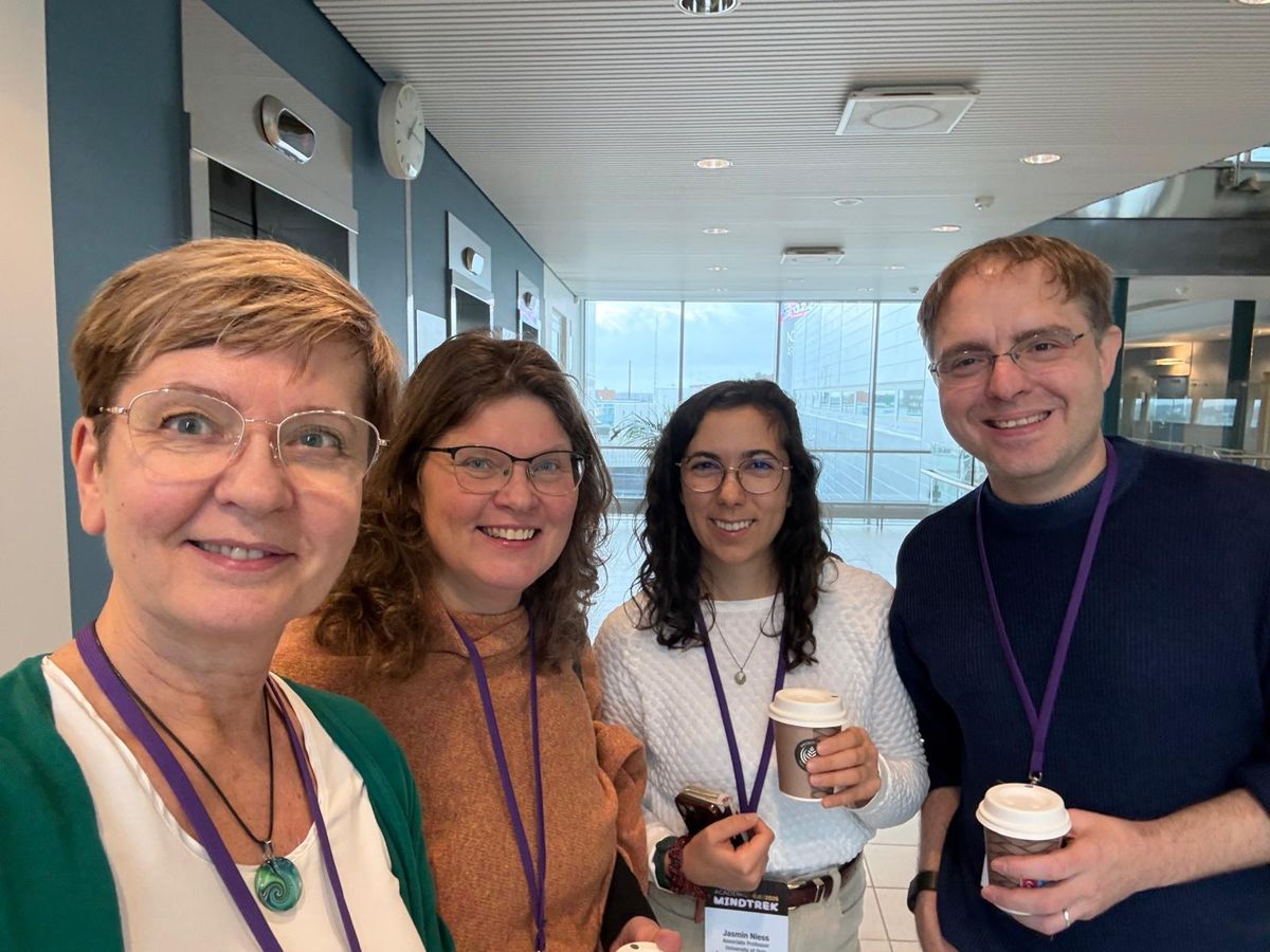Kaisa Väänänen, Jonna Häkkilä, Jasmin Niess and Kai Kunze with coffee cups in the foyer during a break of the Doctoral Consortium