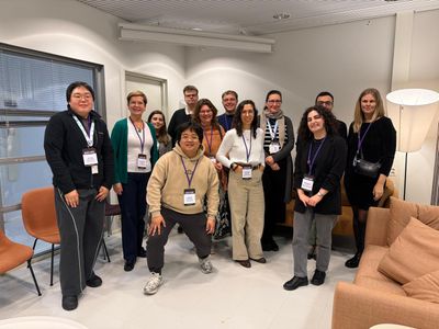 Group photo of the Doctoral Consortium of Academic Mindtrek 2026: the seven doctoral students and the mentors Kaisa Väänänen, Jonna Häkkilä, Jasmin Niess, Mila Bujić and Kai Kunze in a lounge in Tampere