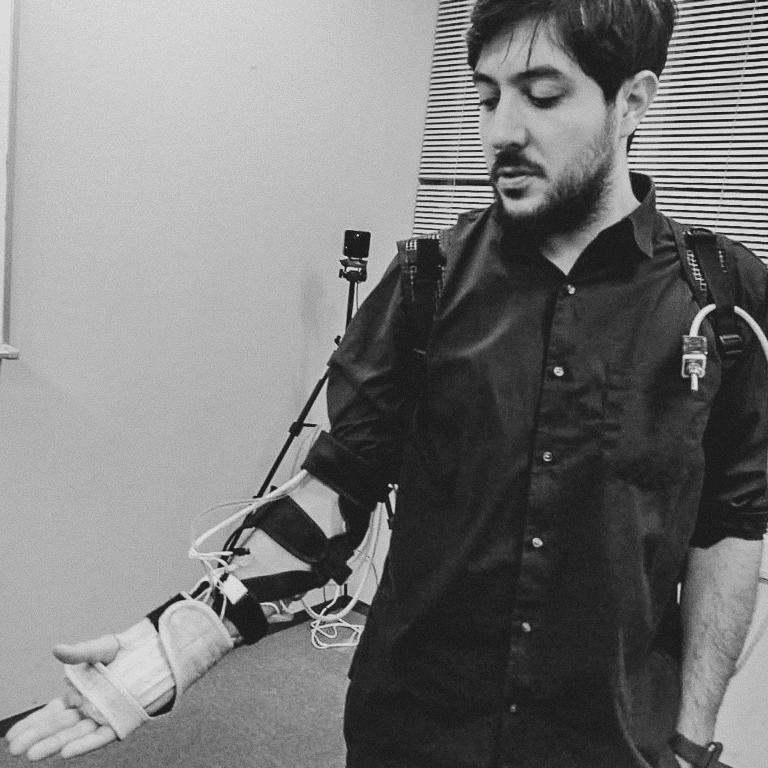 Person wearing an EMS haptic rig for the Experiential Supplements project