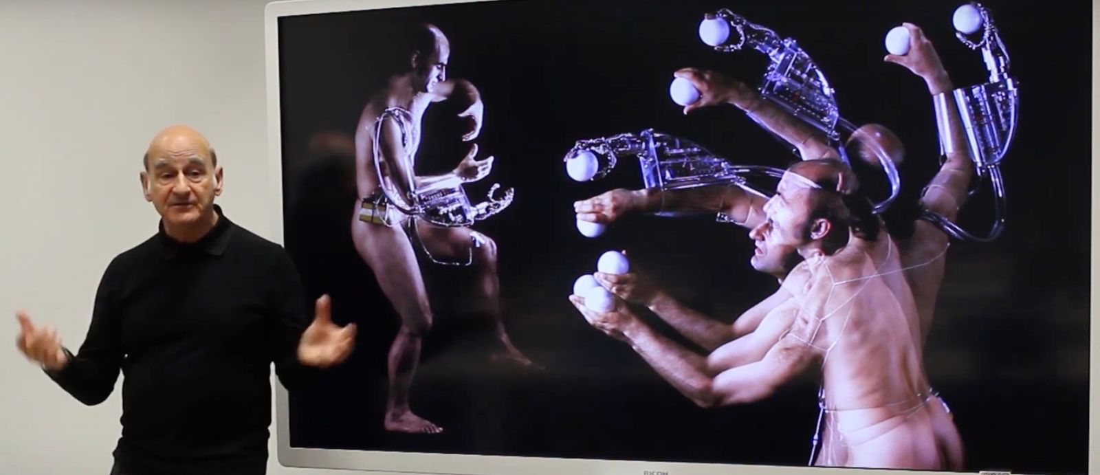 Stelarc presenting his work to the online attendees of Augmented Humans 2020